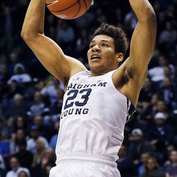 Brigham Young Cougars forward Yoeli Childs (23) dunks the ball against Colorado during an NCAA basketball game against Colorado in Provo on Saturday, Dec. 10, 2016.