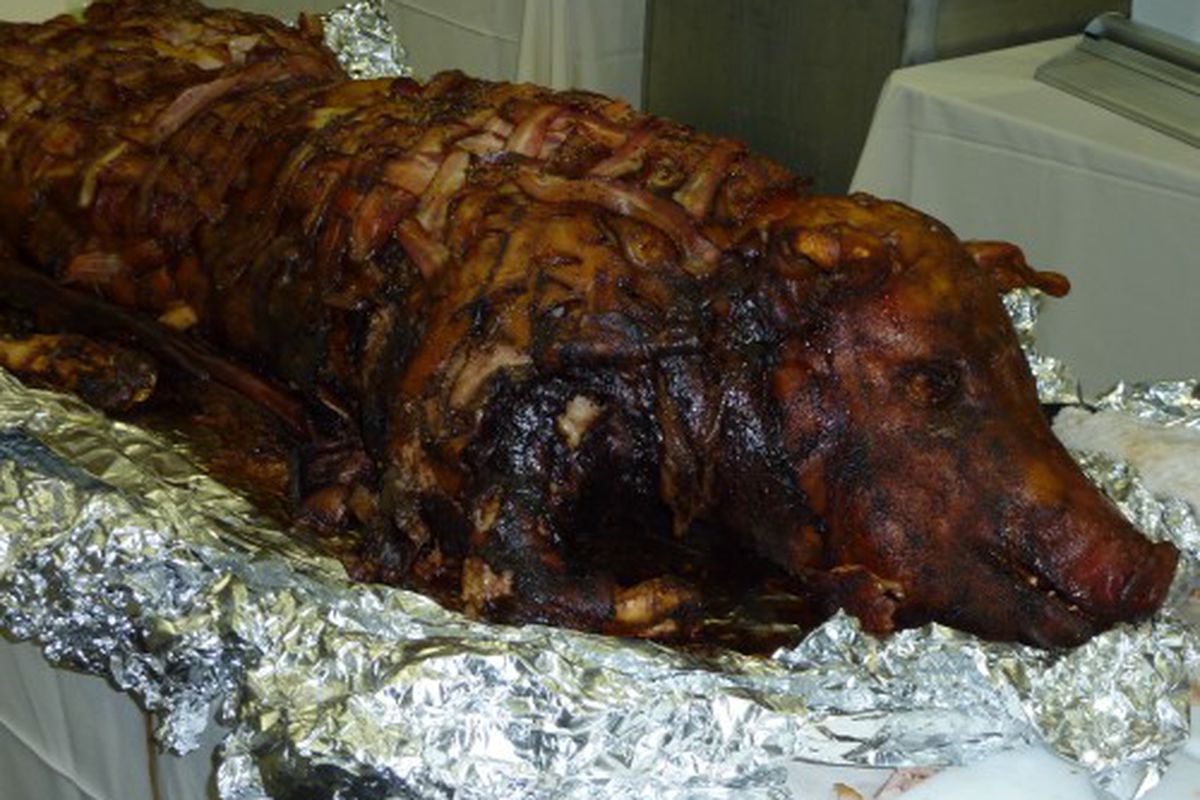 Paddy Long's whole Berkshire hog wrapped in a Nueske's bacon weave