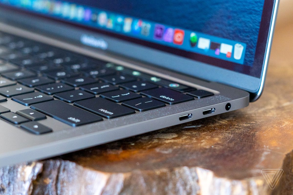 The side view of a 2020 Apple MacBook Pro 13-inch showing two Thunderbolt 3 ports and the headphone jack