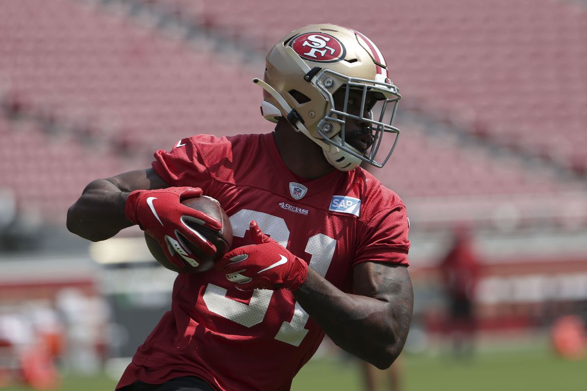 San Francisco 49ers running back Raheem Mostert runs with the football during training camp at Levi s Stadium.