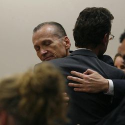 Martin MacNeill hugs attorney Randy Spencer as he thanks his defense team after he was found guilty of murder and obstruction of justice early Saturday, Nov. 9, 2013. MacNeill was hospitalized Thursday night after attempting suicide in his Utah County Jail cell.