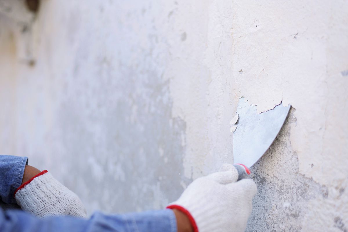 Removing peeling paint from concrete