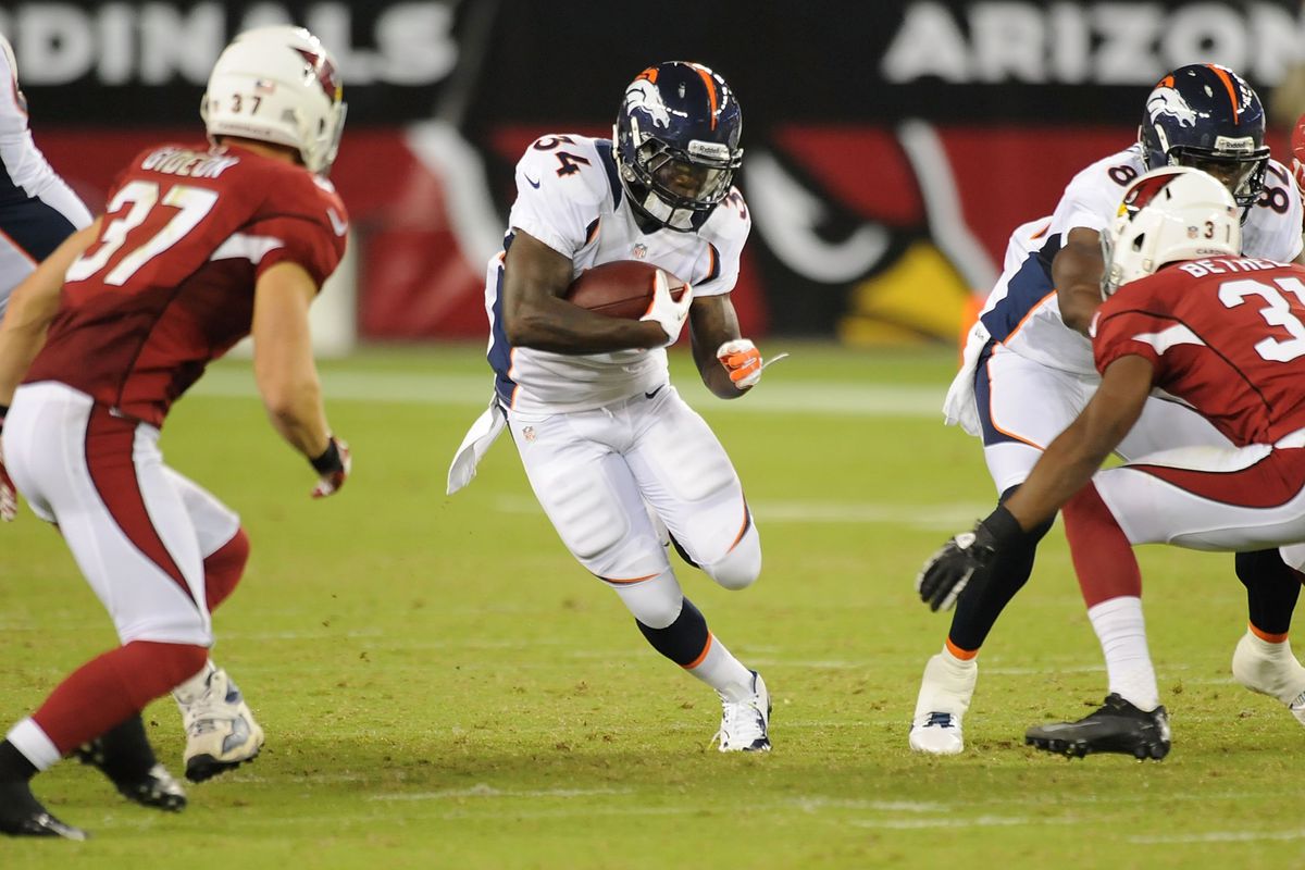 GLENDALE, AZ - AUGUST 30:  Ronnie Hillman #34 of the Denver Broncos runs the ball through the Arizona Cardinals defensive line at University of Phoenix Stadium on August 30, 2012 in Glendale, Arizona.  (Photo by Norm Hall/Getty Images)