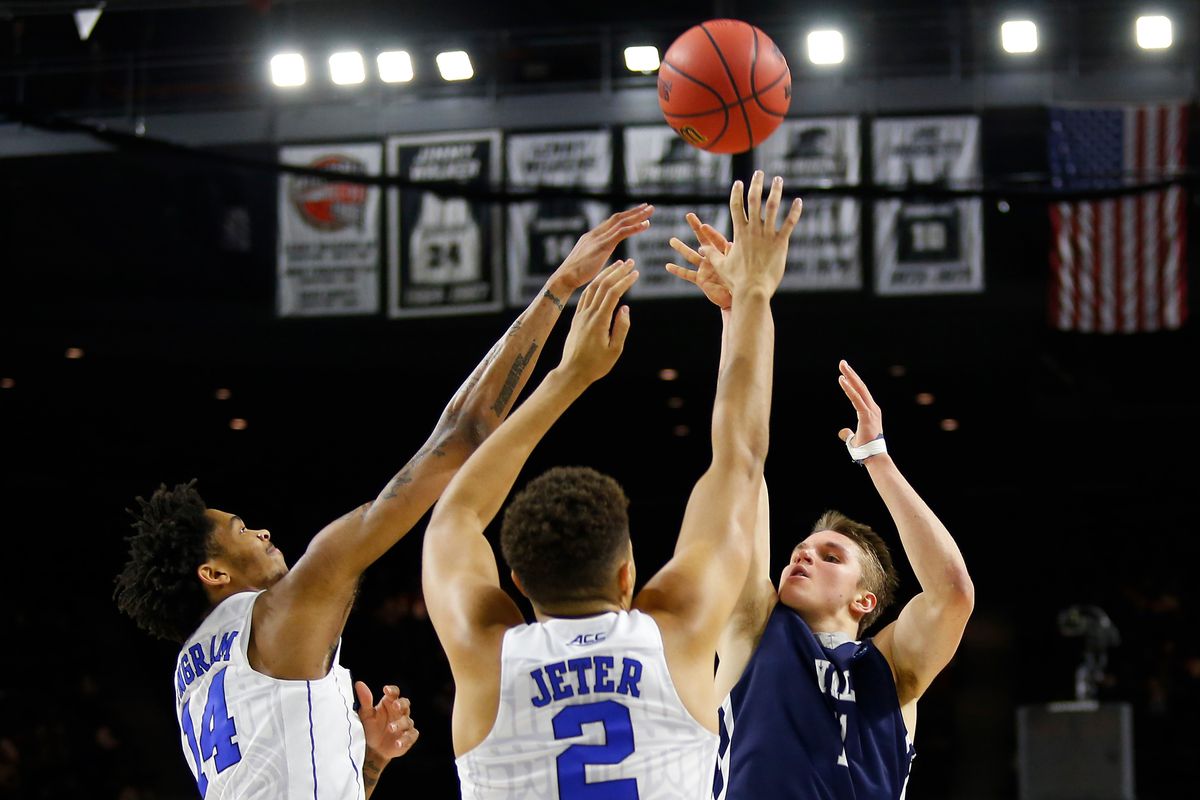 Mar 19, 2016; Providence, RI, USA; Yale Bulldogs guard Anthony Dallier (1) shoots over Duke Blue Devils guard Brandon Ingram (14) and forward Chase Jeter (2) during the first half of a second round game of the 2016 NCAA Tournament