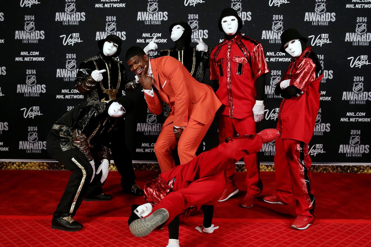 LAS VEGAS, NV - JUNE 24: P.K. Subban of the Montreal Canadiens poses with members of the Jabbawockeez dance crew on the red carpet 