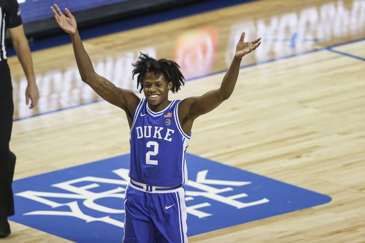 Duke Blue Devils guard DJ Steward celebrates in the final minute as the Duke Blue Devils defeat the Louisville Cardinals 70-56 in the second round of the 2021 ACC tournament at Greensboro Coliseum.