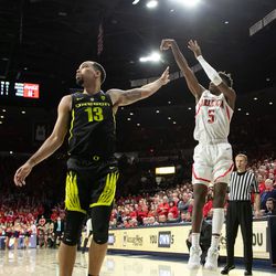 Arizona guard Brandon Randolph (5) shoots past Oregon’s Paul White (13) during the Arizona-Oregon game in McKale Center on January 17 in Tucson, Ariz. Randolph finished the game with only five points.