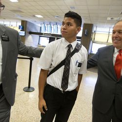 Elder Mercado is greeted by members of The Church of Jesus Christ of Latter-day Saints as missionaries arrive at the Salt Lake City International Airport from Puerto Rico on Wednesday, Sept. 27, 2017. The missionaries, who were serving in Puerto Rico, are part of the last group evacuated Tuesday by the church. They spent the night in Miami and are now on their way to their new temporary assignments. These missionaries lived through both hurricanes Irma and Maria.