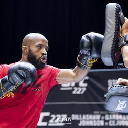 Demetrious Johnson hits mitts at the UFC 227 open workouts in Los Angeles, California.