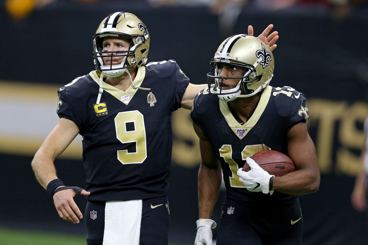 New Orleans Saints wide receiver Michael Thomas celebrates with quarterback Drew Brees after making a fourth quarter touchdown catch against the Arizona Cardinals at the Mercedes-Benz Superdome.