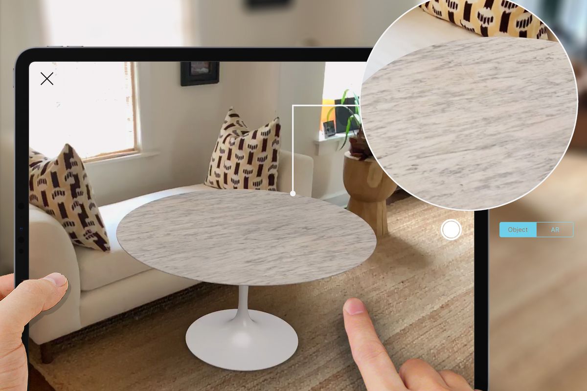 Image of round white table on iPad.