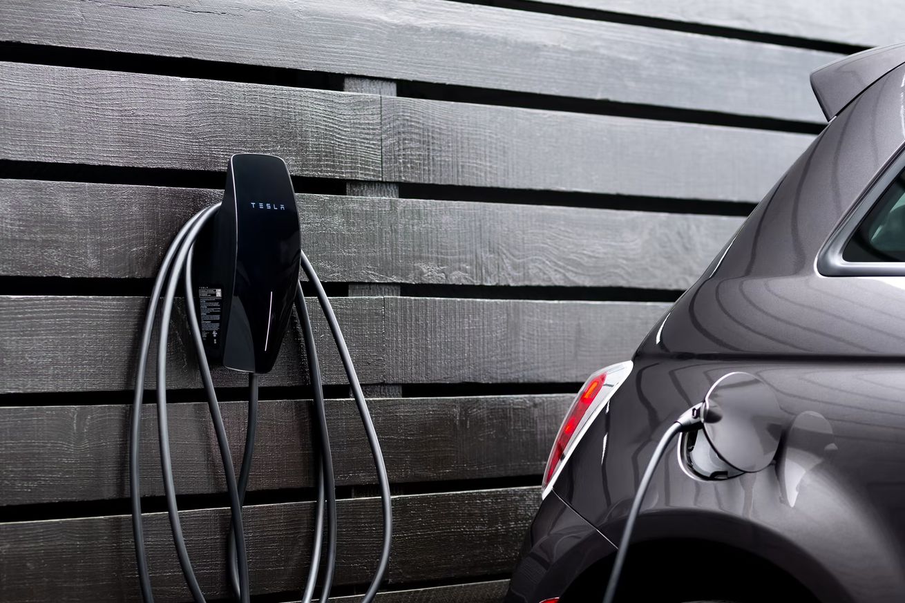 A Tesla J1772 wall charger being used to charge a non-Tesla electric vehicle/