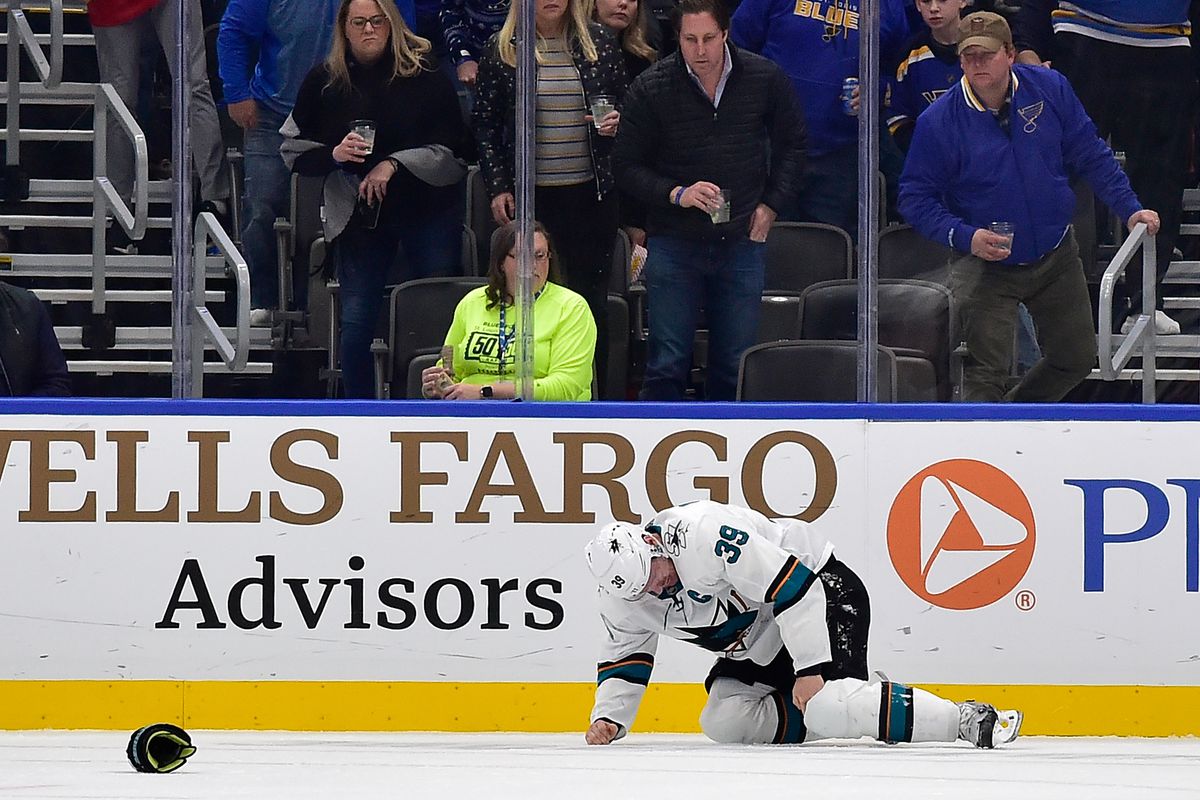 Jan 7, 2020; St. Louis, Missouri, USA; San Jose Sharks center Logan Couture (39) holds his leg after being checked into the boards during the second period against the St. Louis Blues at Enterprise Center.