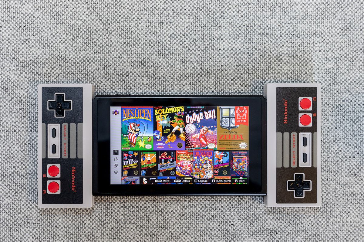 Two NES controllers docked onto the Switch tablet.