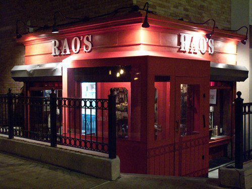 A photo of the red corner exterior of Rao’s restaurant.