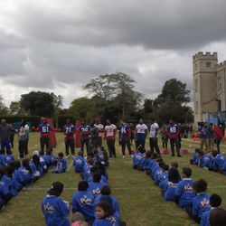 Attentive youngsters listen to players at a Play 60 event