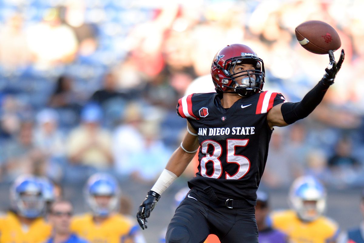Mikah Holder attempting to catch a pass against San Jose State.