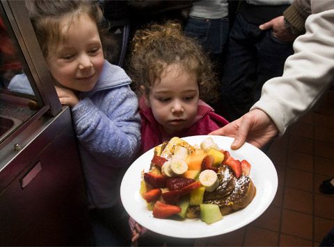 Kids inspect a breakfast dish at the Paramount