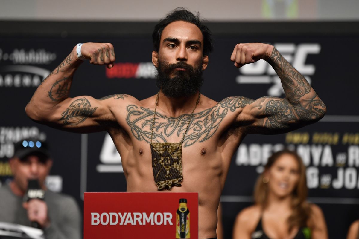 Jose Quinonez poses on the scale during the UFC 248 weigh-in at T-Mobile Arena on March 06, 2020 in Las Vegas, Nevada.