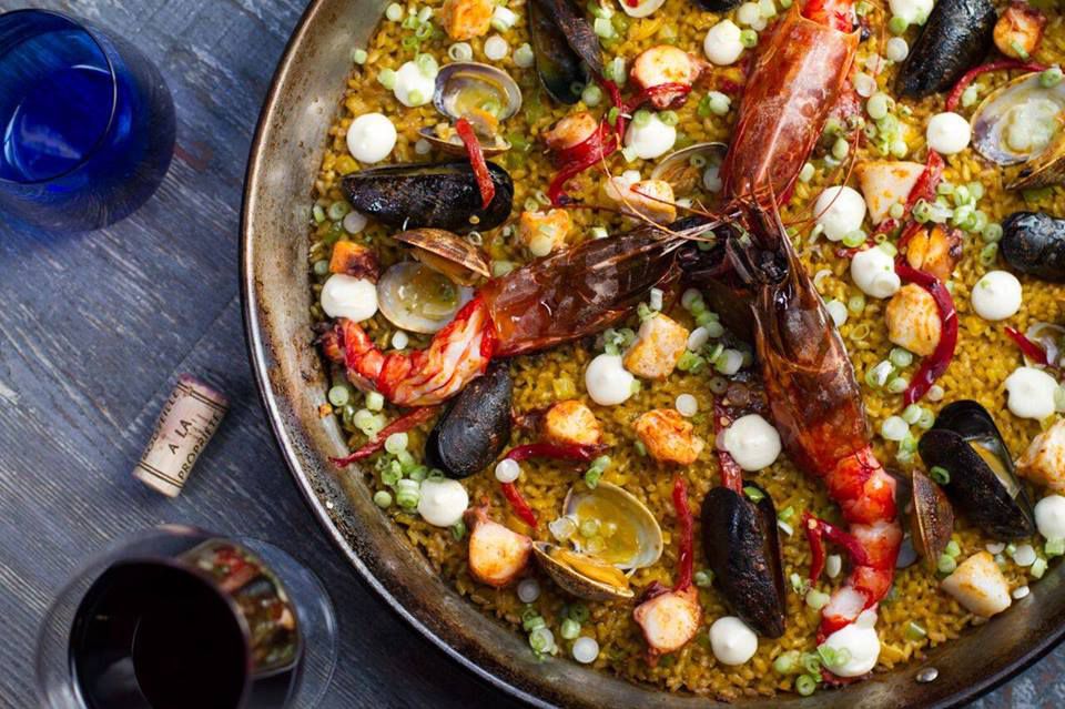Vaca’s overhead paella with rice and seafood.