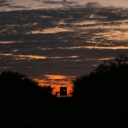 A hunting blind is silhouetted at sunset on Ty Detmer's T14 Ranch Thursday, Nov. 15, 2018, near Freer, Texas.