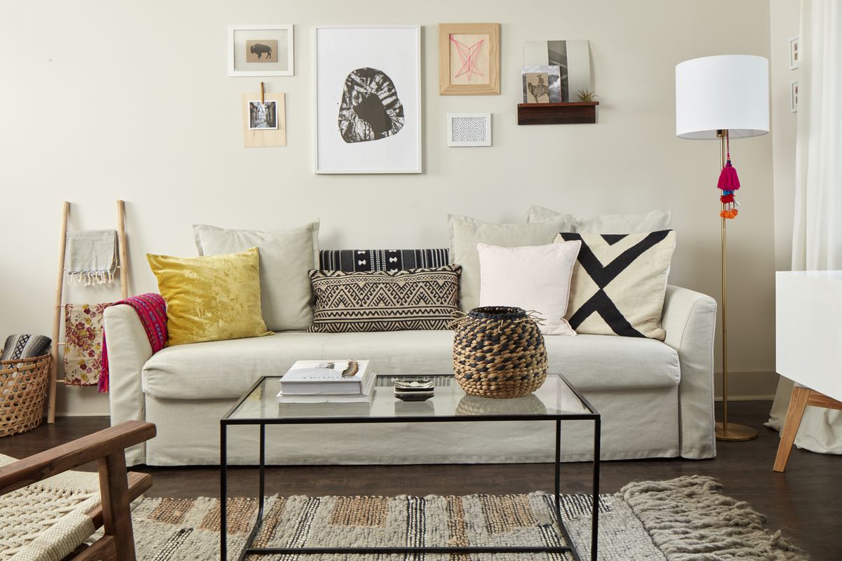 A neutral sofa comes alive with colorful textured and printed pillows.
