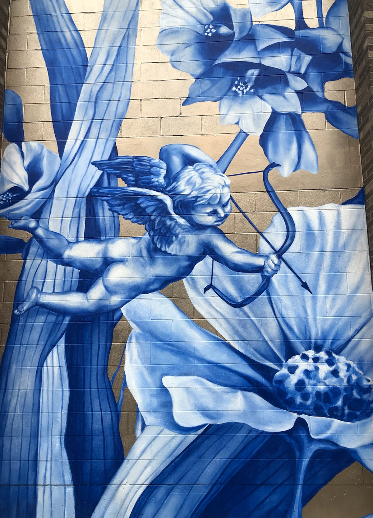 Artist Anna Murphy created the nature-inspired blue-and-white images that give a sense of spirituality to the West Loop mural that features Oprah Winfrey on Green Street between Madison and Monroe.