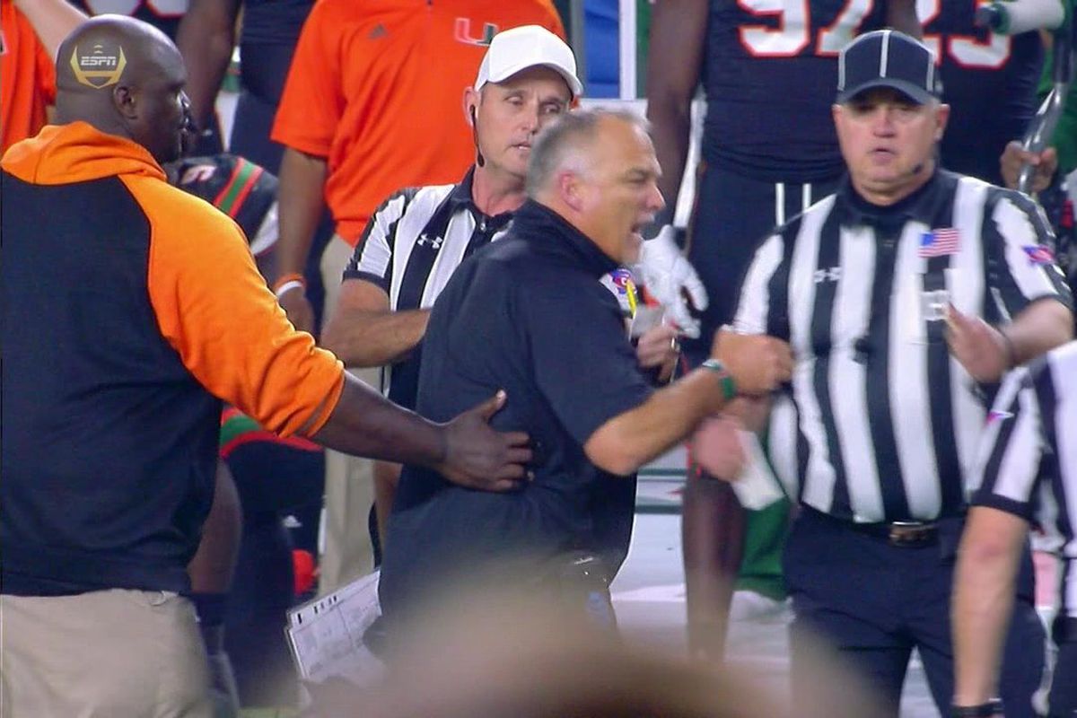 MARK RICHT hit with unsportsmanlike penalty while grabbing official -  