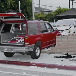 An evidence photo showing the SUV in which Carlos Franco and his daughter Marcela Franco were shot and killed is among several new evidence photos of the June 9 shooting rampage by John Zawahri that were released by the Santa Monica, Calif.,  Police Department at a news conference Thursday, June 13, 2013. 