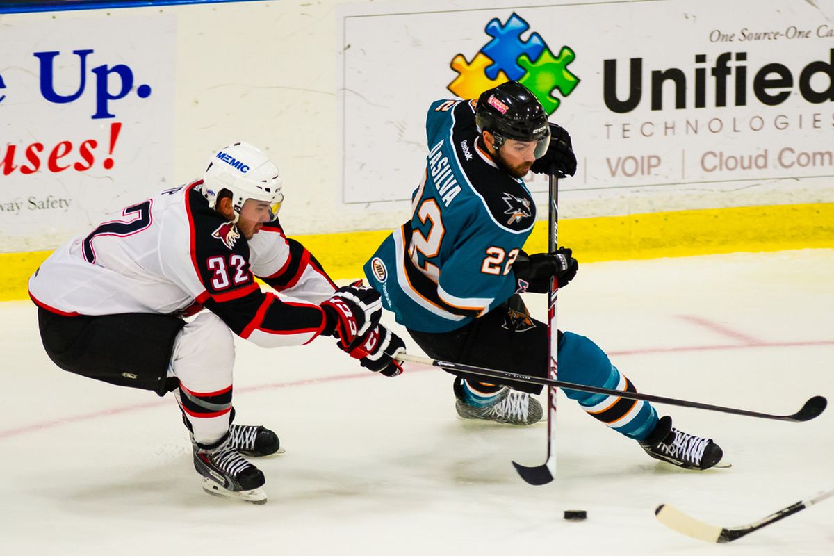 Worcester Sharks forward Dan DaSilva, seen here getting past Portland Pirates forward Brandon Yip, had a four point game with a hat trick Tuesday night in the Sharks' 6-3 road win.