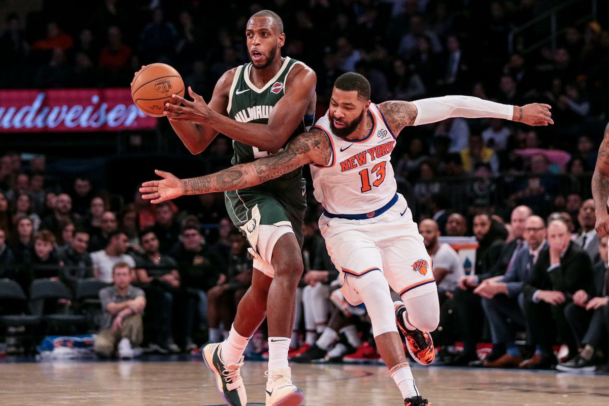 Milwaukee Bucks forward Khris Middleton passes the ball as New York Knicks forward Marcus Morris Sr. defends during the second half at Madison Square Garden.