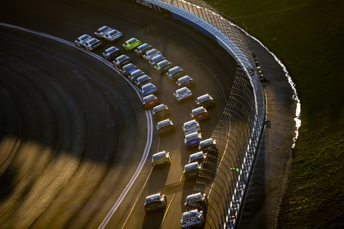 General view as the field of NASCAR Xfinity Series drivers race into turn one during the Nalley Cars 250 at Atlanta Motor Speedway.