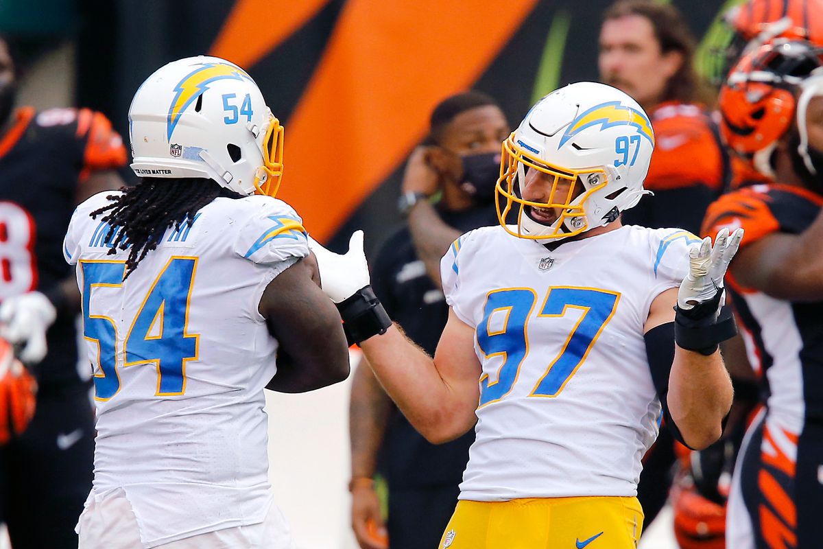 Los Angeles Chargers defensive end Joey Bosa and defensive end Melvin Ingram celebrate a fourth quarter interception against the Cincinnati Bengals at Paul Brown Stadium.