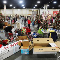 Hundreds decorate Christmas trees in preparation for the Festival of Trees at the South Towne Center in Sandy on Monday, Nov. 28, 2016. The festival runs Wednesday, Nov. 30 through Saturday, Dec. 3, from 10 a.m. to 10 p.m. each day.