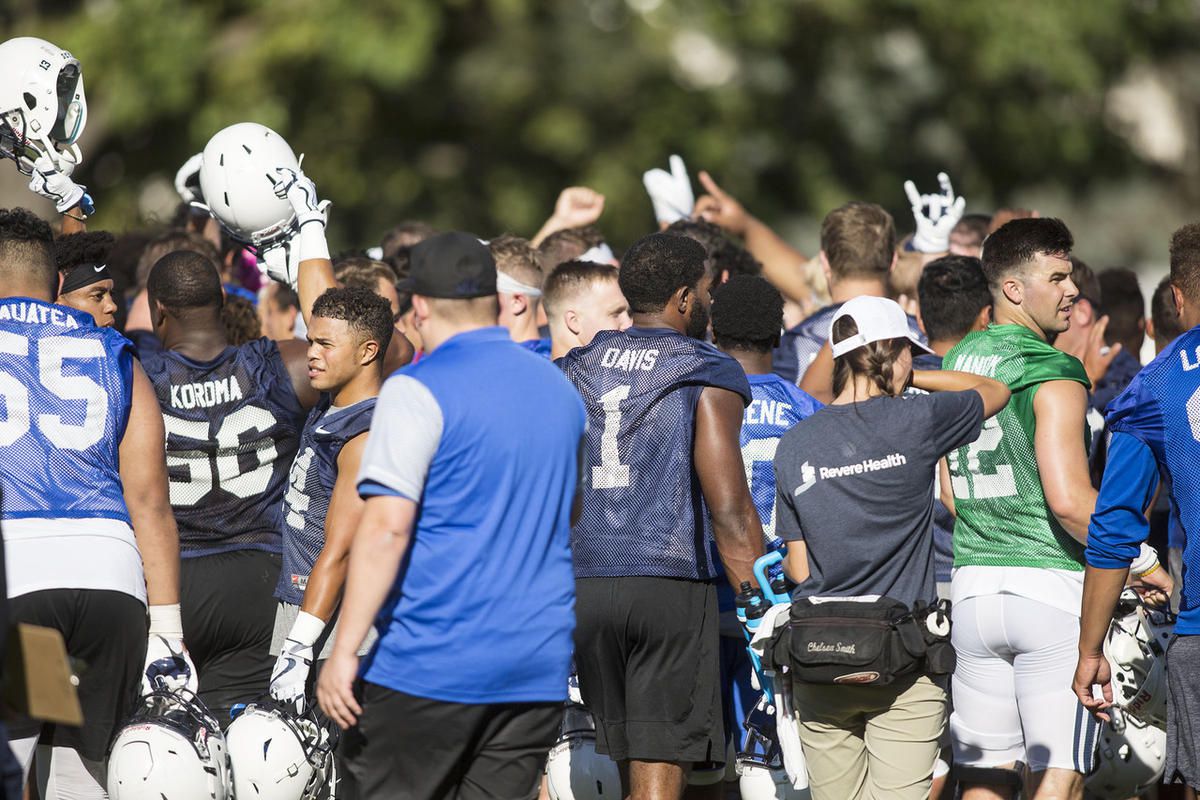 BYU Cougars put their hands in after head coach Kalani Sitake's pep talk after their first practice of the season in Provo on Thursday, July 27, 2017.
