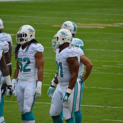 Dec. 15, 2013 Miami Gardens, FL - Miami Dolphins defenders Paul Soliai (96), Philip Wheeler (52), and Cameron Wake (91) during the team's Week 15 game against the New England Patriots.