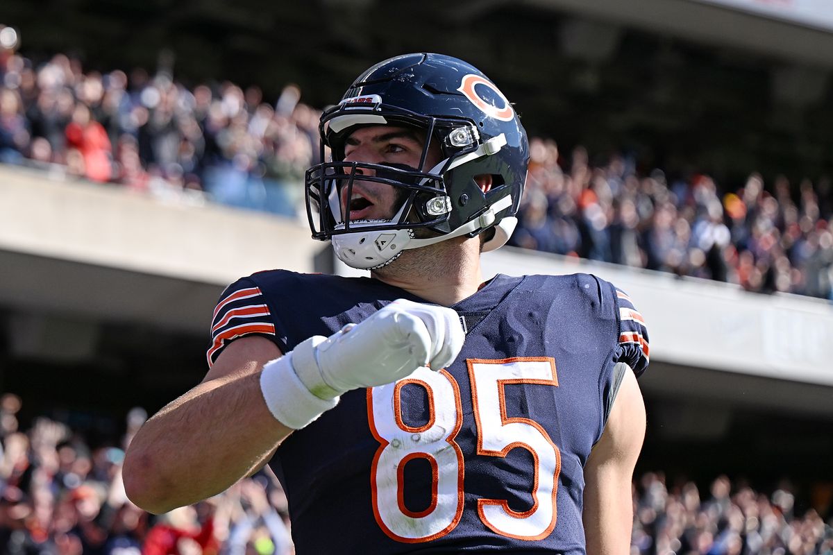 CHICAGO, ILLINOIS - NOVEMBER 06: Cole Kmet #85 of the Chicago Bears reacts after a touchdown during the first half in the game against the Miami Dolphins at Soldier Field on November 06, 2022 in Chicago, Illinois.