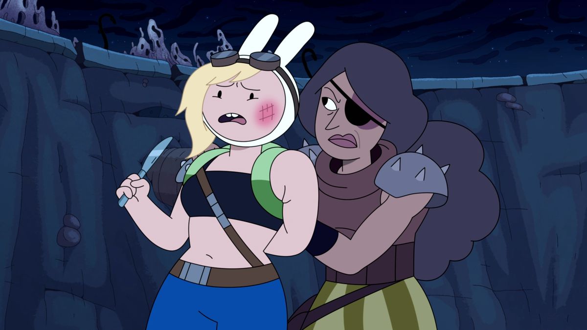 Fionna gets her arm held behind her back by a barbarian-type while holding a butter knife
