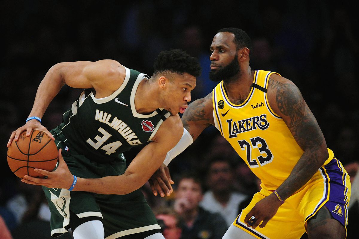 Milwaukee Bucks forward Giannis Antetokounmpo controls the ball against Los Angeles Lakers forward LeBron James during the first half at Staples Center.&nbsp;