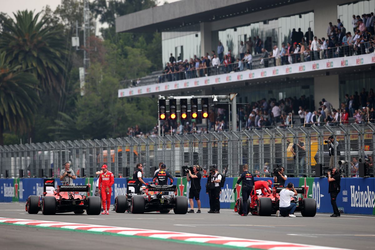 A general view of parc ferme as pole position qualifier Max Verstappen of Netherlands and Red Bull Racing celebrates with second place qualifier Charles Leclerc of Monaco and Ferrari and third place qualifier Sebastian Vettel of Germany and Ferrari during qualifying for the F1 Grand Prix of Mexico at Autodromo Hermanos Rodriguez on October 26, 2019 in Mexico City, Mexico.