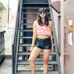 Chanelle of <a href="http://thepenelopetimes.com"target="_blank">The Penelope Times</a> is wearing a Gypsy Junkies top, H&M shorts, Penelope's Vintage sunglasses and LuLu*s boots.  