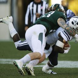 Brigham Young Cougars running back Jamaal Williams (21) runs for a first down on 4th down against the Michigan State Spartans  in East Lansing, MI on Saturday, Oct. 8, 2016.