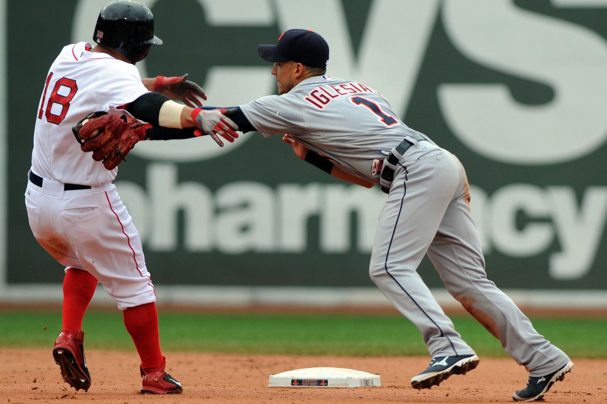 Jose Iglesias makes the tag on Shane Victorino at Fenway Park on September 2, 2013