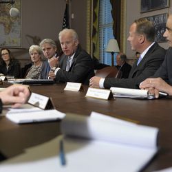 FILE- In this Jan. 11, 2013, file photo Vice President Joe Biden, center, speaks during a meeting with representatives from the video game industry in Washington. President Donald Trump plans to meet with representatives from the video game industry on Thursday, March 8, 2018. After the shooting at Sandy Hook elementary school in Newton, Conn., Biden held three days of wide-ranging talks on gun violence prevention including a meeting with video game industry executives. (AP Photo/Susan Walsh, File)