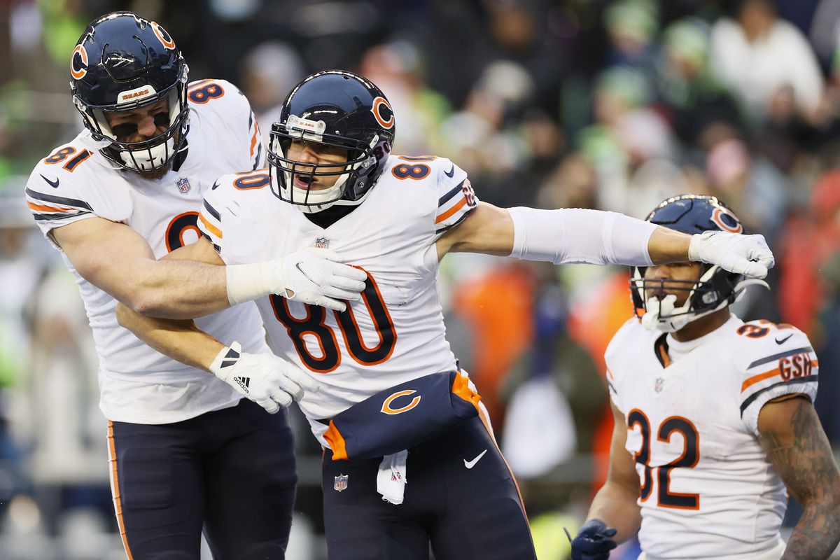 Jimmy Graham #80 of the Chicago Bears celebrates with J.P. Holtz #81 after catching the ball for a touchdown during the fourth quarter against the Seattle Seahawks at Lumen Field on December 26, 2021 in Seattle, Washington.