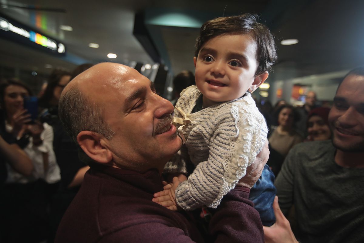 Syrian Refugee Family Arrives In U.S. As Immigration Ban Is Debated In Court