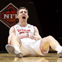 Utah Utes forward Tyler Rawson (21) celebrates after a foul and basket as Utah and UC Davis play in an NIT basketball game at the Huntsman Center in Salt Lake City on Wednesday, March 14, 2018. Utah won 69-59.
