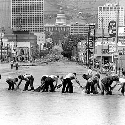 Sandbaggers work on 700 South in Salt Lake City as State Street is turned into a river due to flooding in the spring of 1983.