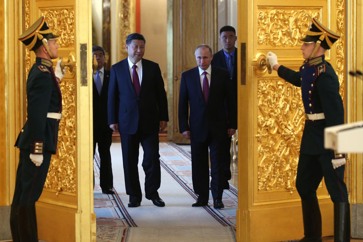 Russian President Vladimir Putin receives Chinese President Xi Jinping in Moscow
