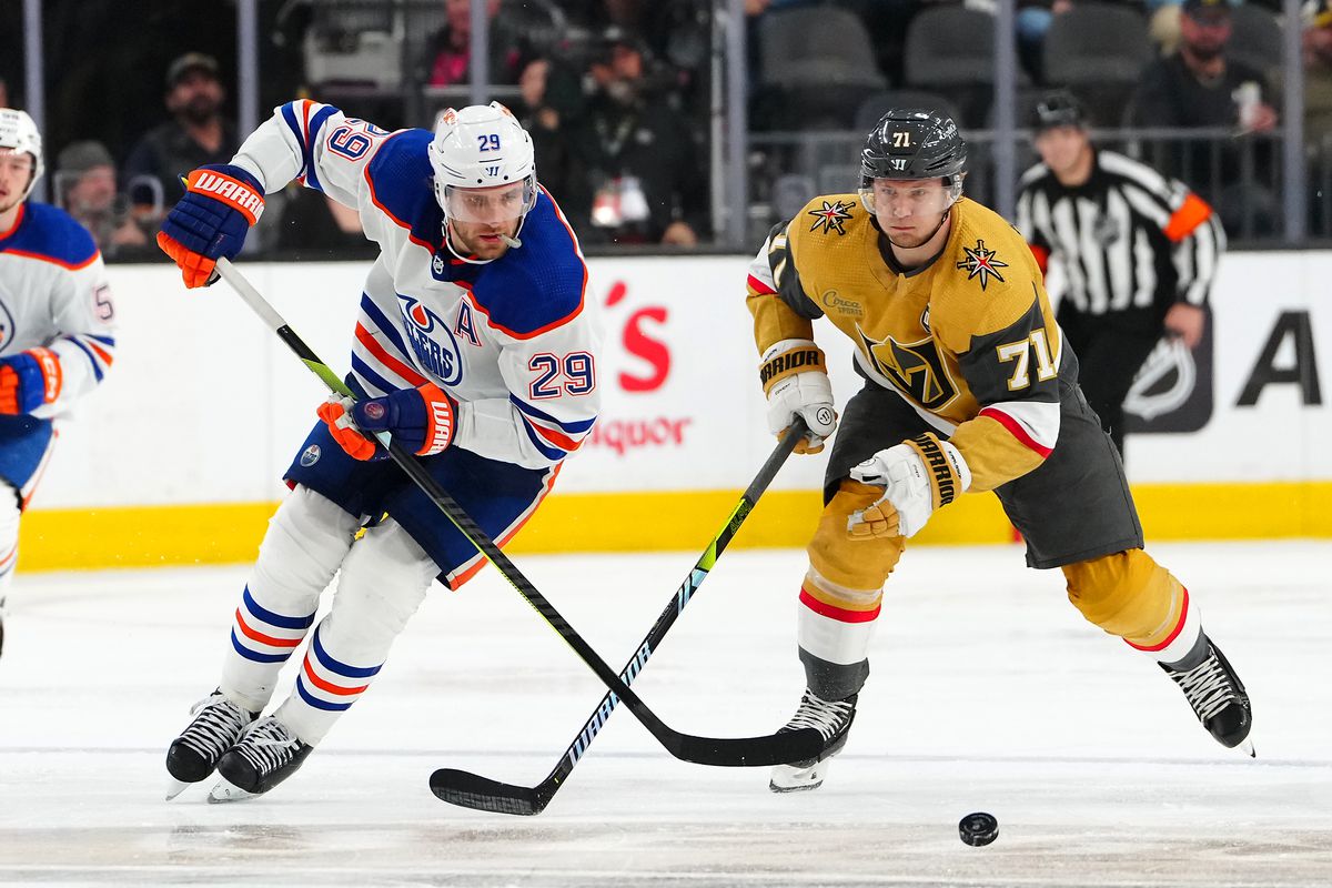 Edmonton Oilers center Leon Draisaitl (29) tips the puck ahead of Vegas Golden Knights center William Karlsson (71) during the third period at T-Mobile Arena.